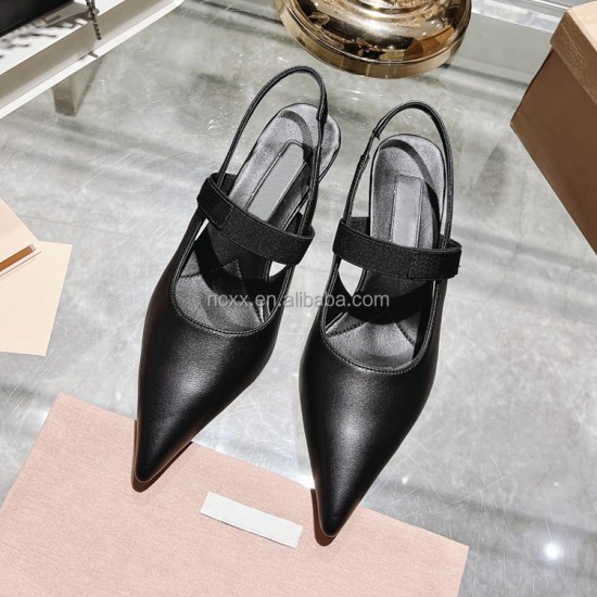A Woman with a New Style of Pointed-toe Cool Shoes Made of Genuine Leather